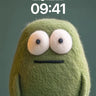 Fuzzy Green Creature Wallpaper with Knitted Feet wallpaper for iPhone, iPad & Mac
