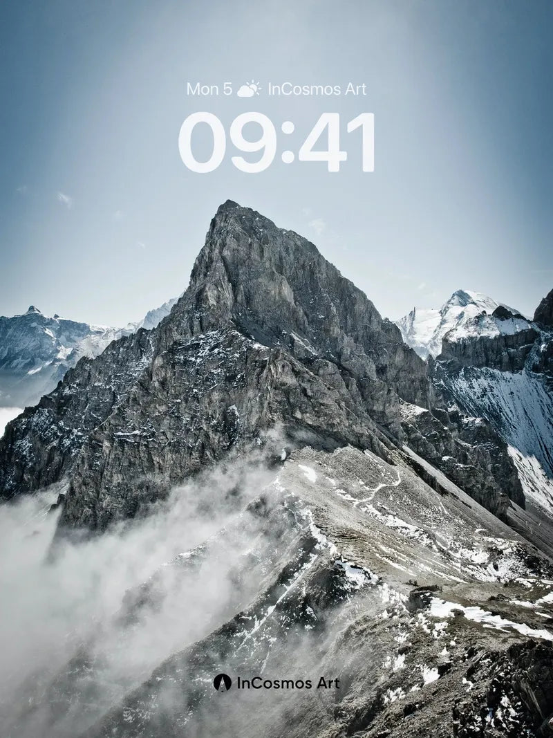 Frost-etched Summit Wallpaper with Whispering Clouds