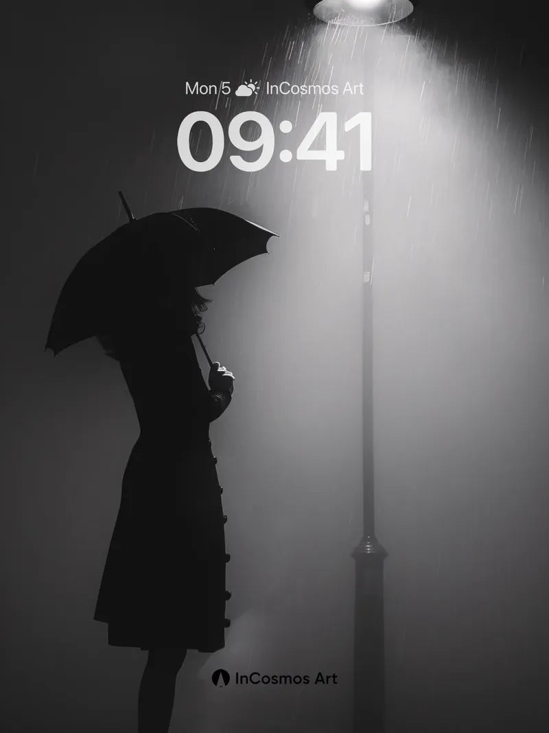 Silhouetted Rainfall Wallpaper with Streetlamp Glow