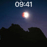 Crimson Eclipse Wallpaper with Shadowed Peaks wallpaper for iPhone, iPad & Mac
