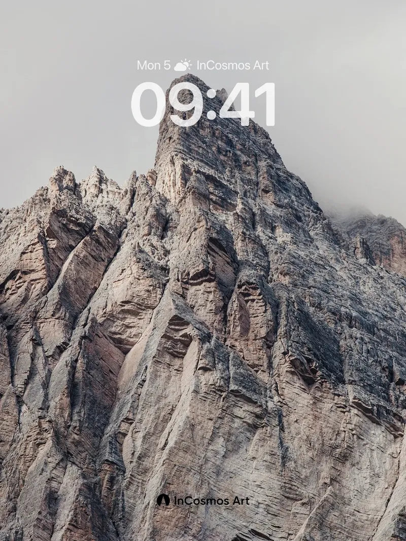 Stone Whisper Wallpaper with Cloud-Capped Spire