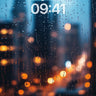 Rain-Soaked Cityscape Wallpaper with Blurred Lights wallpaper for iPhone, iPad & Mac