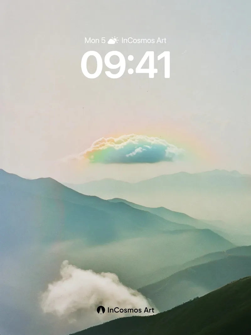 Serene Rainbow Cloud Wallpaper with Misty Peaks