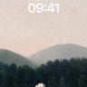 Serene Mist Lake Wallpaper with Distant Cottage wallpaper for iPhone, iPad & Mac
